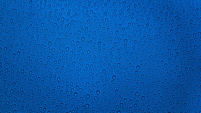 Water droplets Blue background