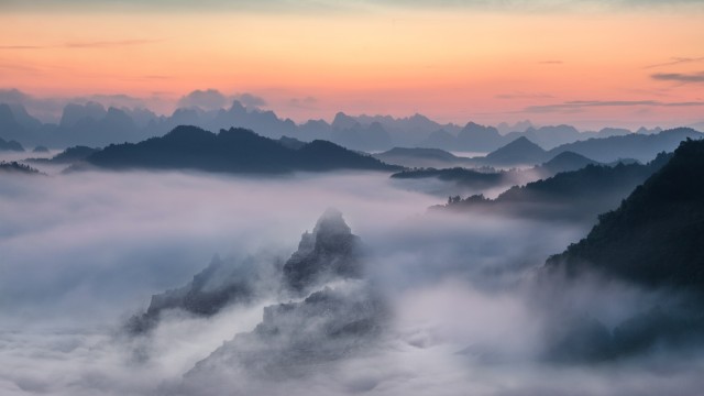 Mountain range Foggy sunset