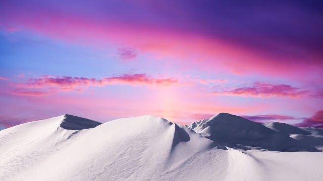 Snowy mountain with a Sunset in the background